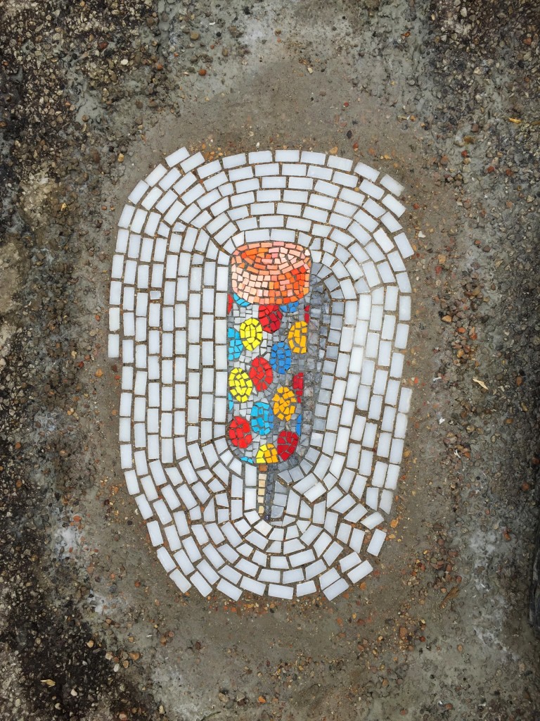 artist creates mosaics in potholes4