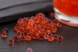Small bubbles of juice made using spherification 