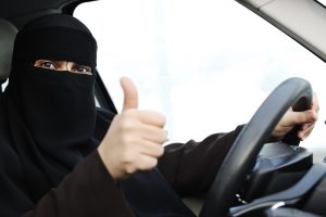 An Arab woman driving a car