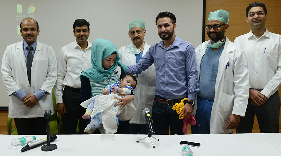 Iraqi Baby With Eight Limbs Have Them Removed - Money Sharma/AFP