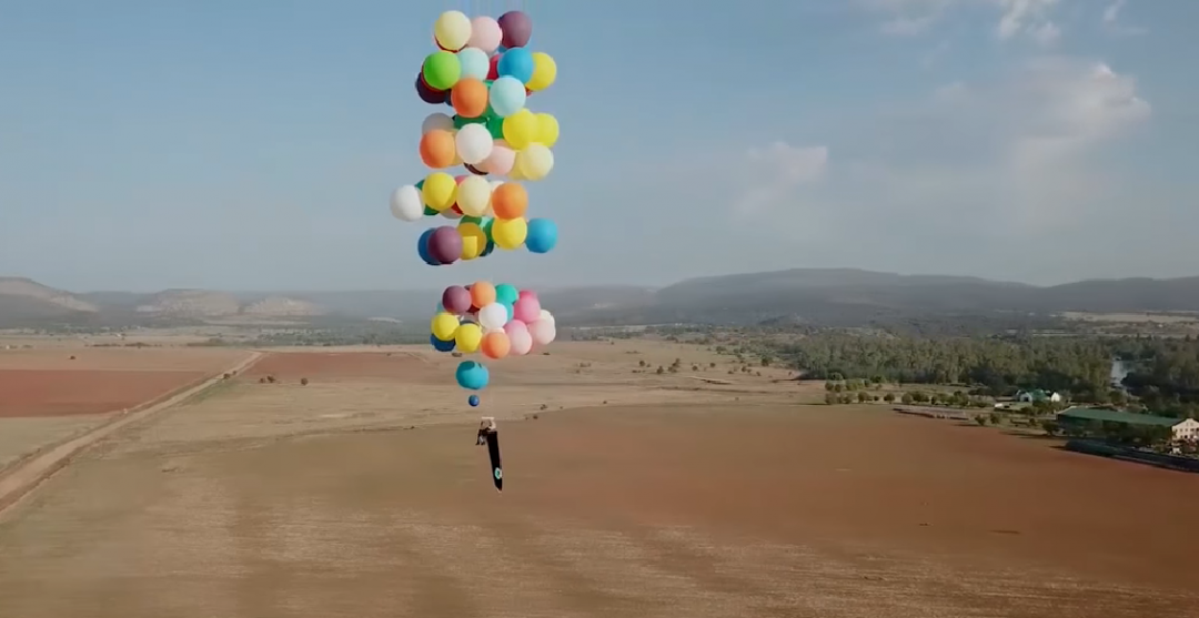 Tom Morgan flew 'Up' above South Africa using a camping chair ties to 100 helium balloons
