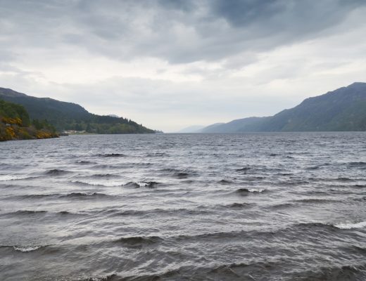 two tourists take pictures of the Loch Ness Monster on the same day