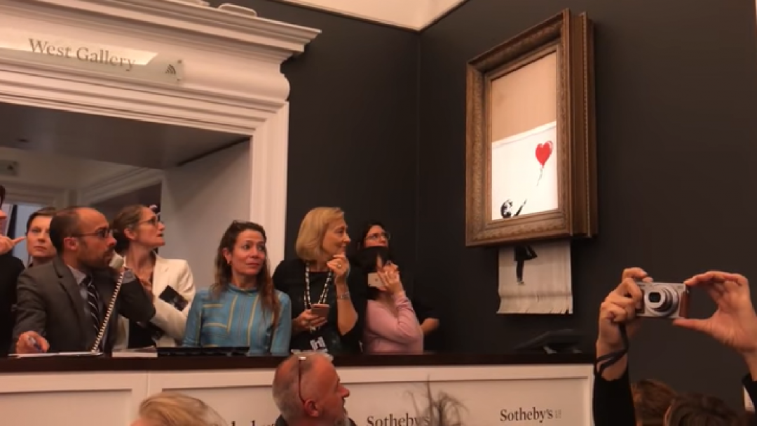artist Banksy activated a built-in shredder in one of his paintings during Sotheby’s auction